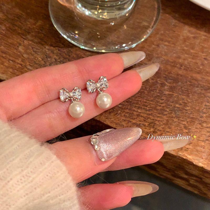 

Доступная роскошь Жемчуг Женский Самый продаваемый Уникальный без пирсинга Банты Pair of silver white pearl 925 tremella needle