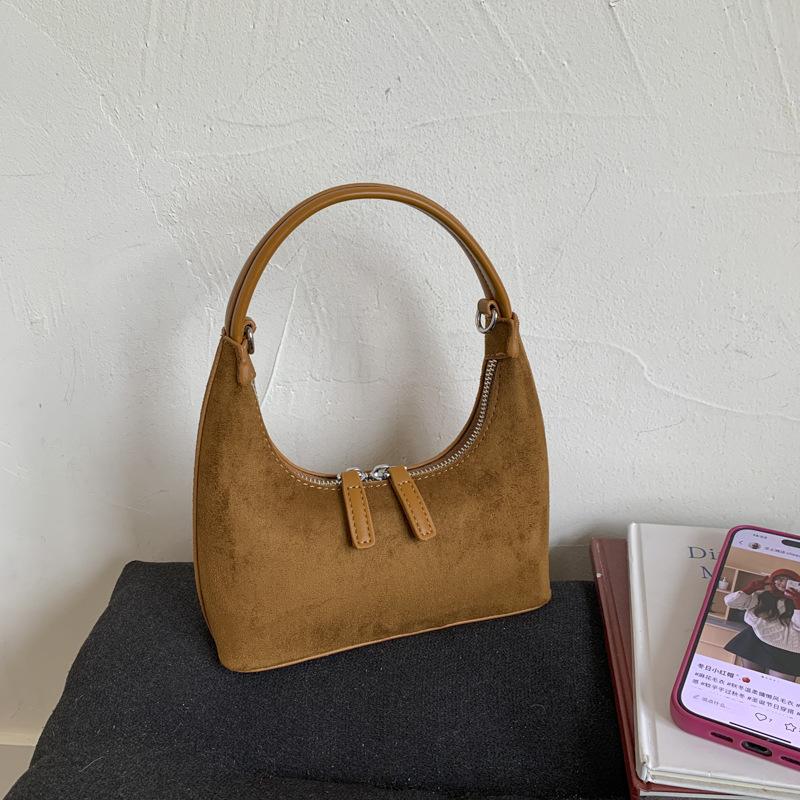 Retro fashion dumpling bag women 2025 new bag high sense light luxury niche commuting single shoulder cross hand bag