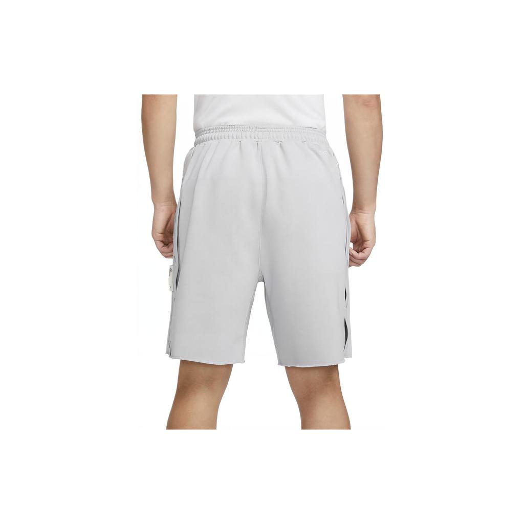 Nike Pantalones cortos de baloncesto Dri-FIT Sport Standard Issue de color sólido con cordones de tiro medio para hombre Gris Lobo Negro FN2891-012