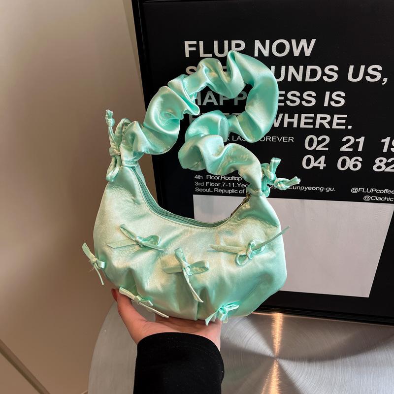 

Niche pleated bow lady lady handbag 2025 spring new Korean version age-reducing armpit shoulder cloud озеро синий
