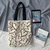 Black & White HyunA Floral Canvas Schoolbag: Single-Shoulder, Large Capacity for Students