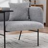 Modern single armchair with comfortable fabric backrest and two storage compartments, complemented by a practical side table.