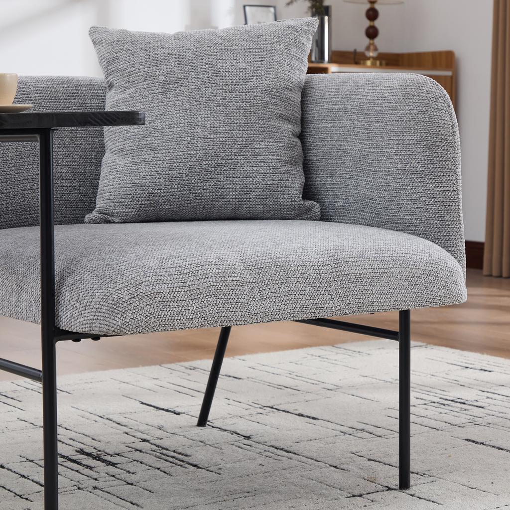 Modern single armchair with comfortable fabric backrest and two storage compartments, complemented by a practical side table.