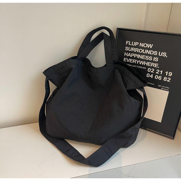 

Solid color large-capacity women s bag versatile simple autumn and winter new commuter casual light messenger bag tote class purple чёрный