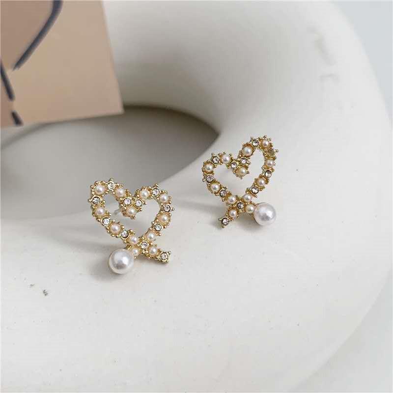 S925 Silver Needle Korean Temperament Irregular Hollow Love Pearl Earrings Small Versatile Love Stud Earrings Women