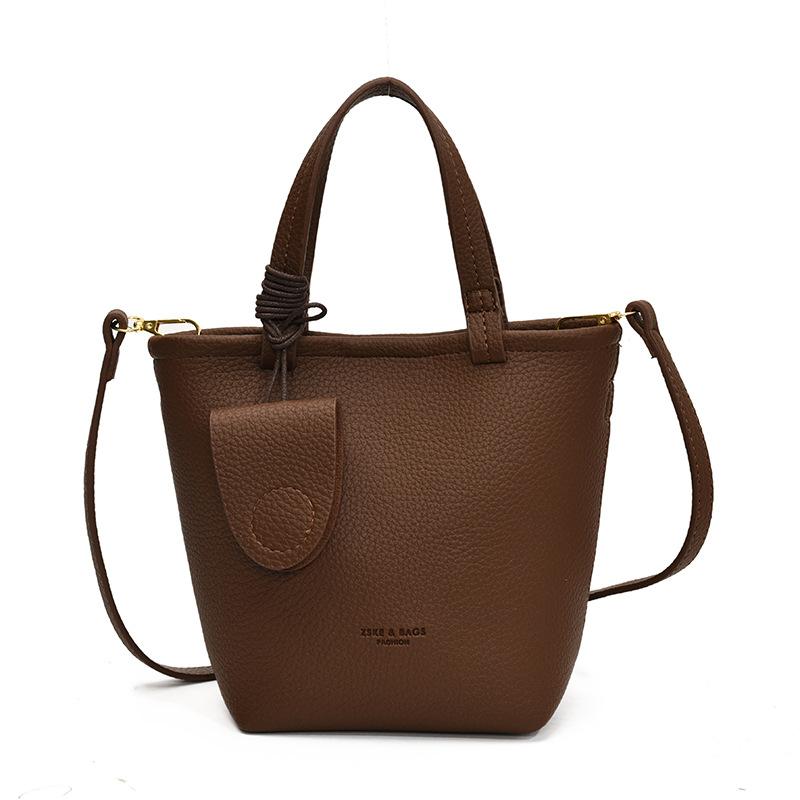 

Simple niche portable vegetable basket bag women s 2025 autumn and winter new versatile texture bucket bag commuter messenger bag