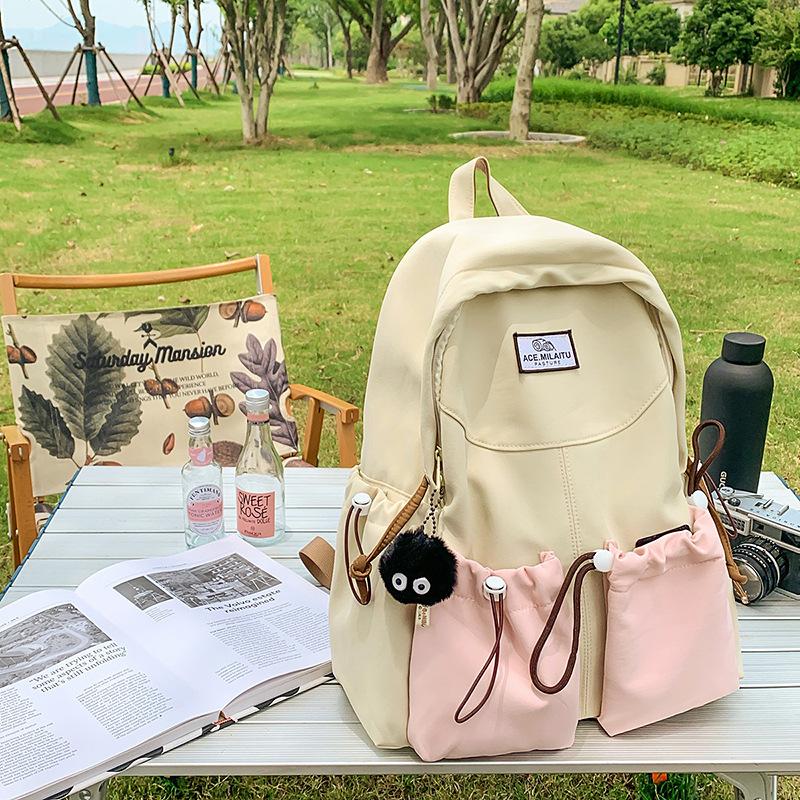 New high-value college-style men's and women's schoolbags, Korean version school students, contrasting colors, casual commuting, versatile backpack.