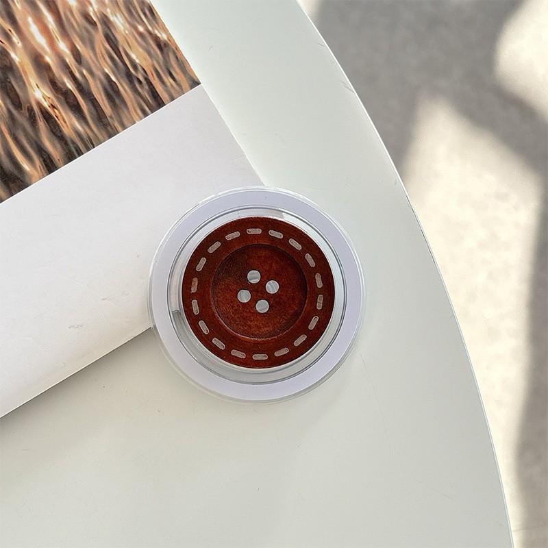 

Solid Color Simple Button Wooden Desktop Watching TV Shows Mobile Phone Airbag Holder Magnetic Suction Suitable Magsafe Adhesive Type