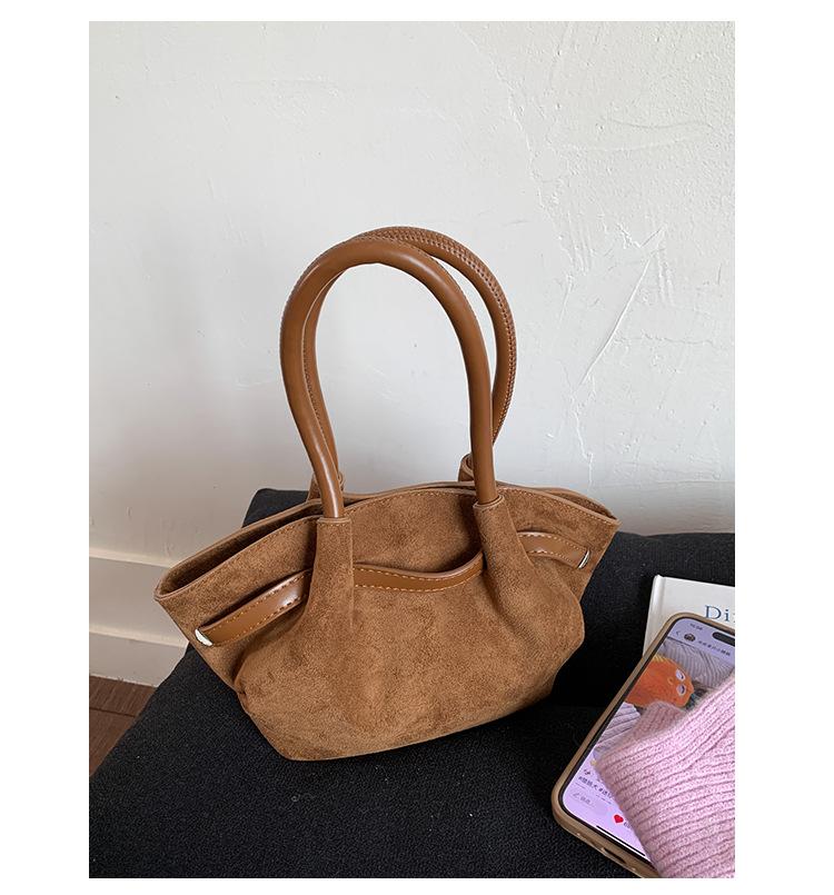 Frosted retro portable small bag women's 2025 new fashion bucket bag niche design messenger bag wing bag tide