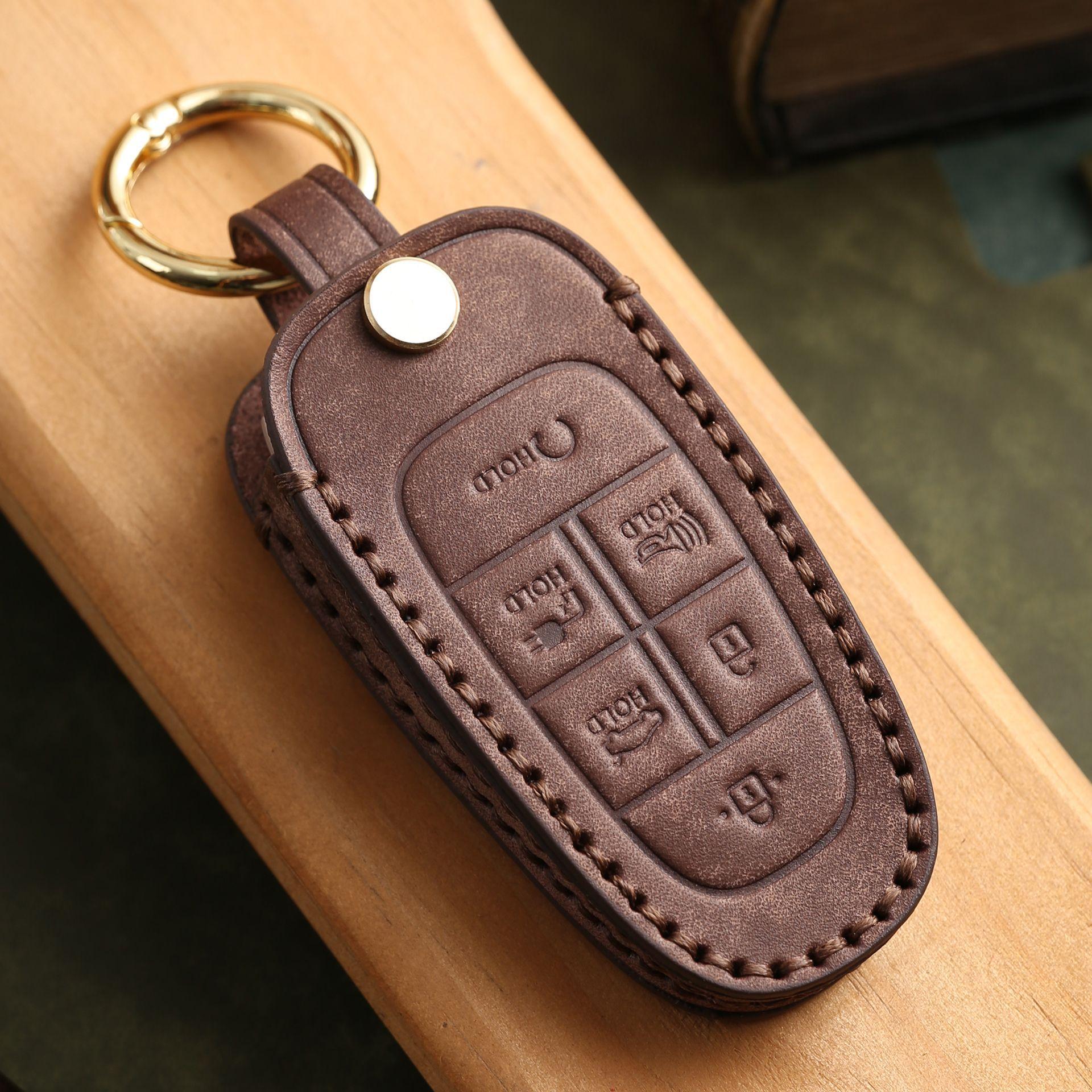 

Customized leather key cover is suitable for modern cars with pure hand-stitching, high-end key protection, shell buckle, cowhide коричневий