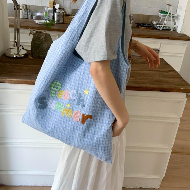 Kleine frische karierte tragbare Tragetasche Damentasche 2025 Sommer neue Mode Buchstaben-Schultertasche trendige Achseltasche