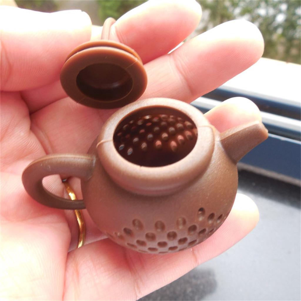 Durable Teapot-Shape Tea Infuser Strainer Silicone Tea Bag Leaf Filter Diffuser. Durable Teapot-Shape Tea Infuser Strainer Silicone Tea Bag Leaf Filter Diffuser.