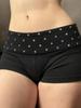 Pantaloncini a maglia ultra-corti a vita bassa con rivetti, stile europeo e americano - Abbigliamento casual sexy e snellente