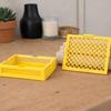 Container with a lid, yellow openwork organizer for small items for the home