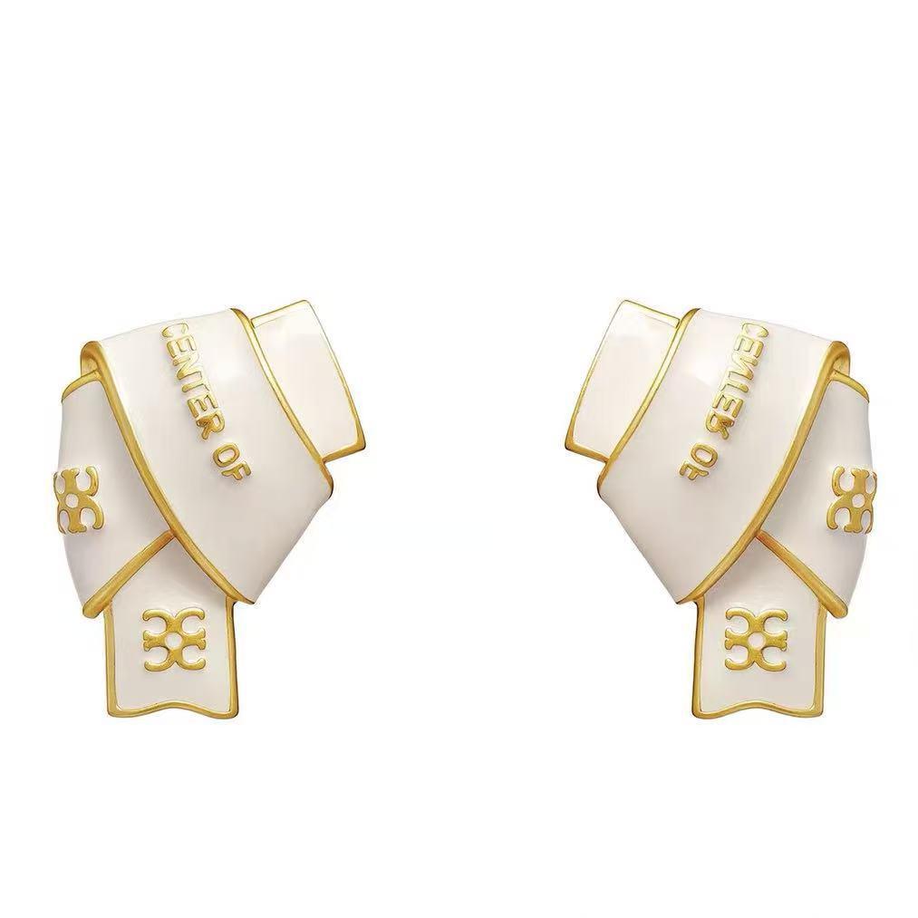 Black & Gold Enamel Twist Earrings: Versatile Luxury Studs for Autumn/Winter 2025