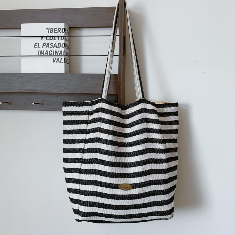 

Полосатая контрастная парусиновая сумка 2025 новая сумка для отдыха на плечо большой вместимости сумка-тоут сумка для покупок чёрный