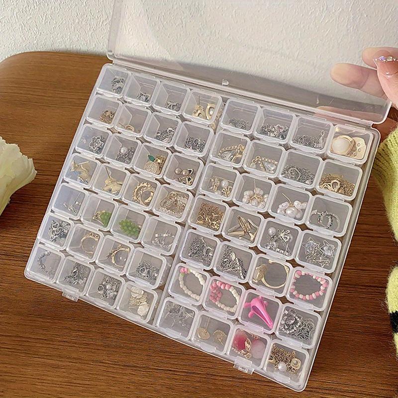 A Transparent Plastic Jewelry Box with 28/56 Compartments for Storing Earrings, Beads, and Crafts.