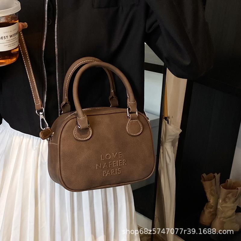 Niche Retro Bowling Bag Women's 2025 Spring New Shoulder Messenger Bag Premium Texture Coffee Handbag