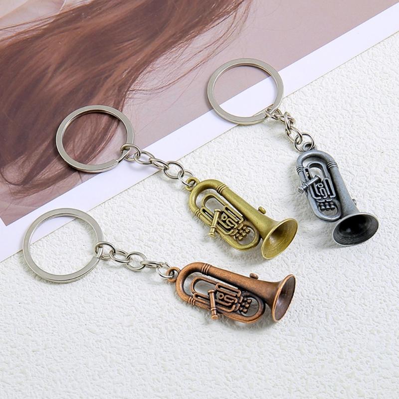 Winziger Saxophon-förmiger Schlüsselanhänger Hochwertige Metallkonstruktion Tolles Geschenk für einen Freund Saxophon-Schlüsselanhänger Taschenanhänger