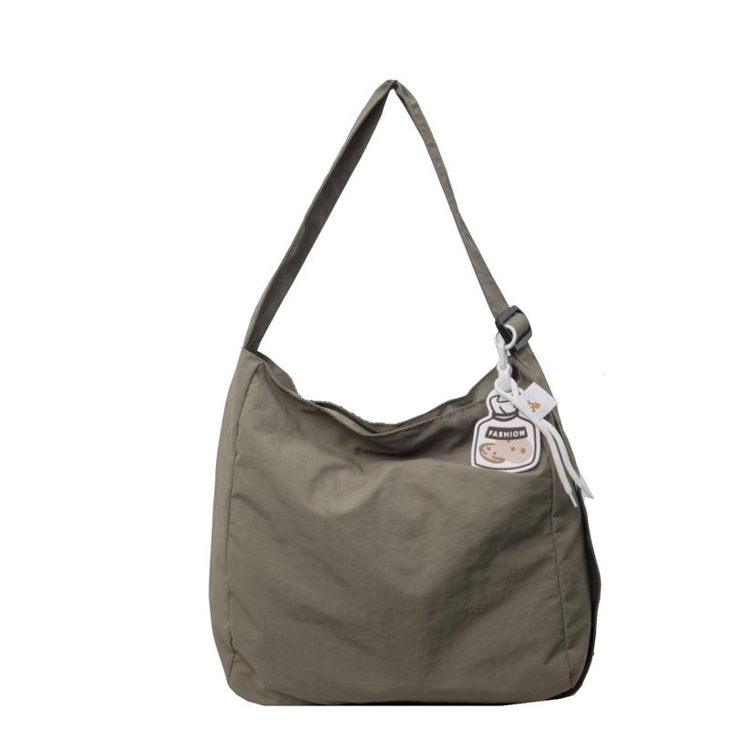 

Премиальная наплечная сумка для девочек, большая вместимость, простая сумка-мессенджер для поездок на работу, студенческая универсальная нишевая портативная сумка-тоут зелёный