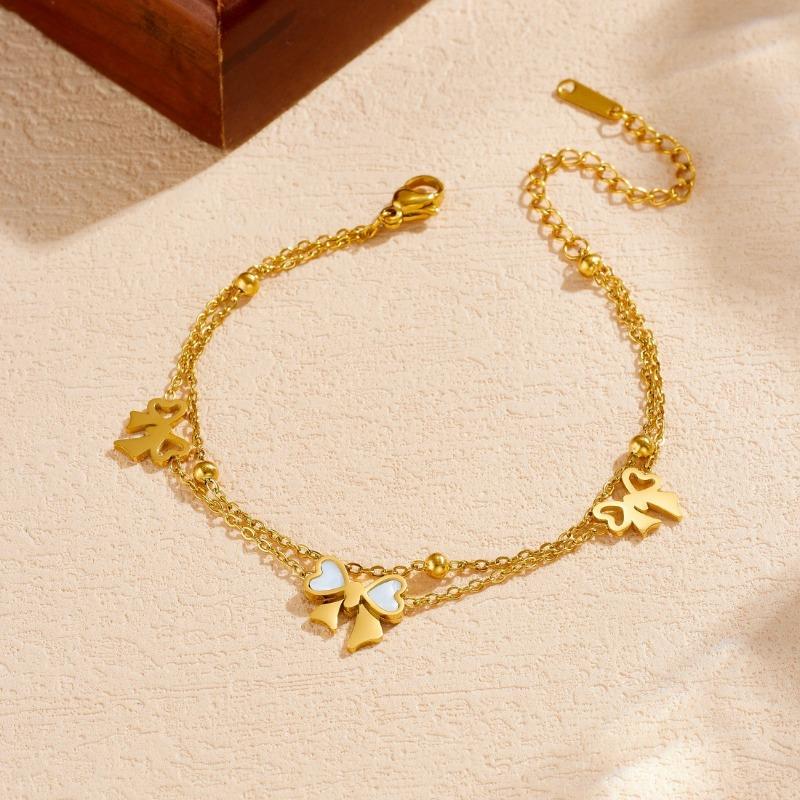 Gold Bow Charm Jewelry Set: Necklace and Bracelet with White Enamel Accents