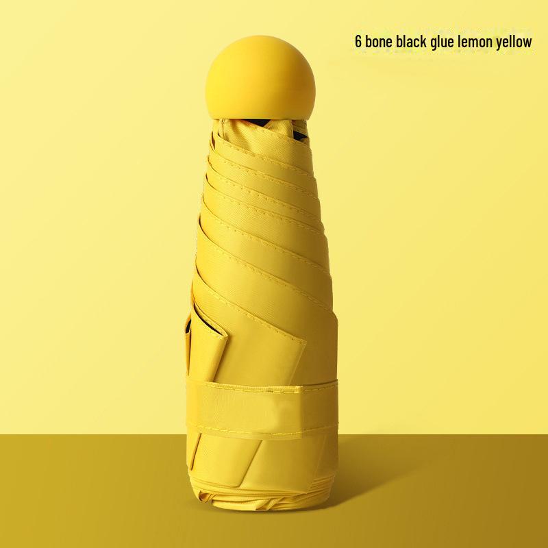 50 % rabatt på svart kapselparaply i lommeformat - Seks-skjerms sammenleggbar for sol og regn