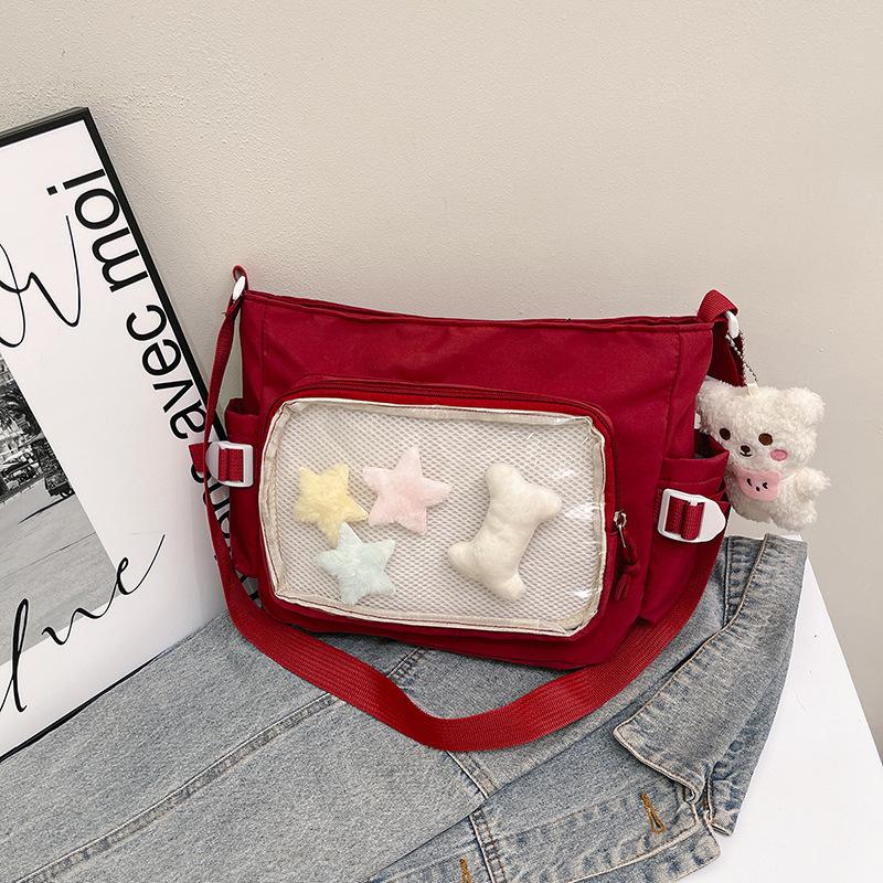 2025 College-Stil vielseitige Klasse Ladebuch einfache große Kapazität leichte Freizeittasche weiblich transparent Riegel Schulterschmerz-Tasche