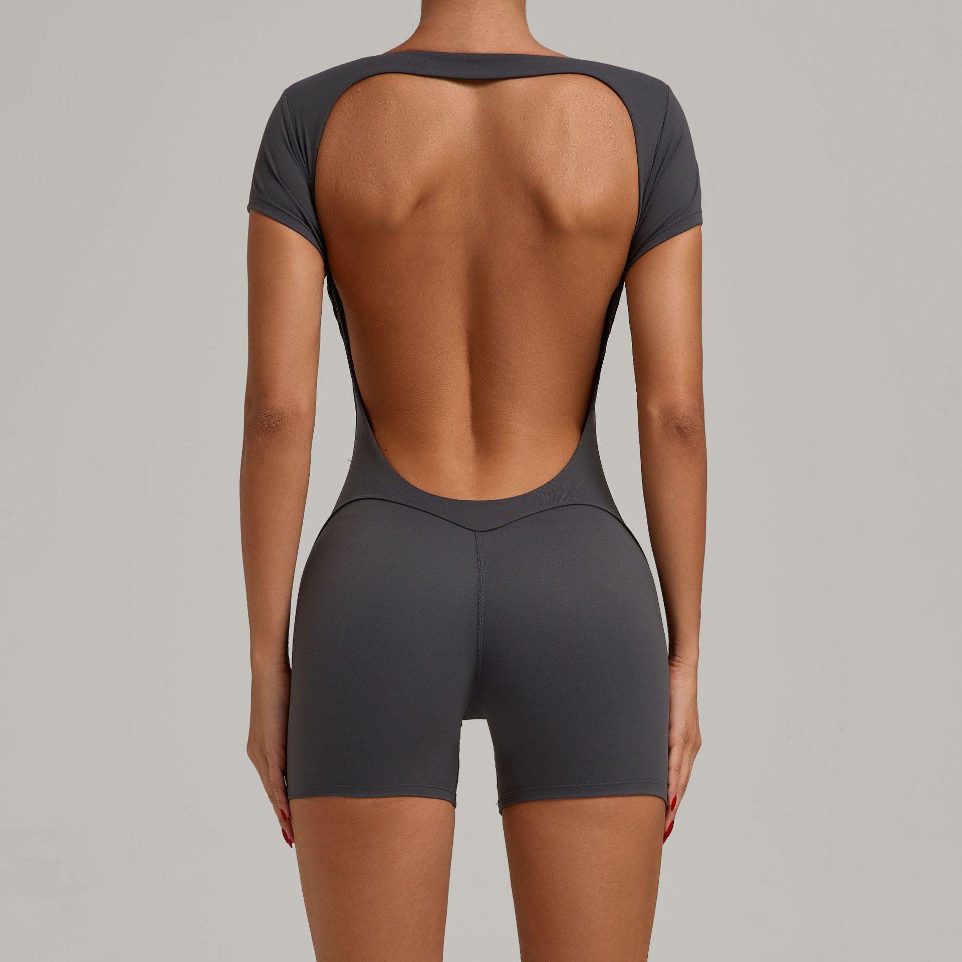 

Європейський та американський відкритий ззаду персиковий стегна облягаючий суцільний костюм для йоги - з коротким рукавом для танців, фітнесу та спорту Extra Large деревне вугілля/сірий колір