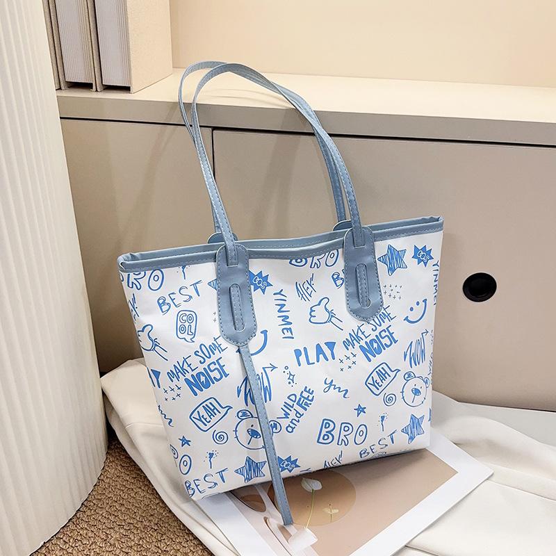 

Premium light luxury tote bag large capacity fresh and sweet printed shoulder bag fashionable versatile handbag bag синій