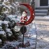 Festive Lawn Ornament 31 Inch Solar-Powered Christmas Garden Stake Light, Santa Claus On A Moon LED Pathway Solar Light with Snowflake Charm,