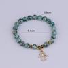 European & American Hot Selling Sesame Stone Mala Beads Bracelet with Personalized Palm Pendant