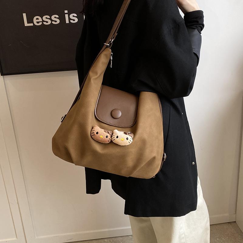 

Рюкзак женский большой вместимости 2025 новый повседневный нишевый дизайн многофункциональная сумка кроссбоди сумка-пельмень рюкзак 31*12.5*36 коричневый