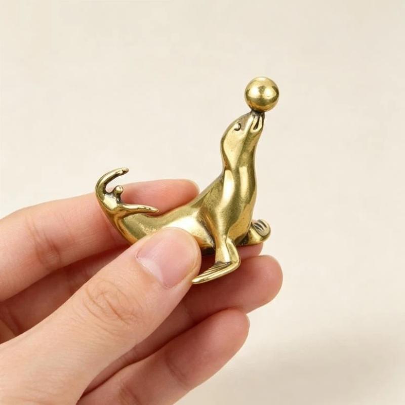 Brass Sea Lion Figurine With Vintage Crafted Design And Balancing Ball Detail Perfect For Home Desk Decor Small Gifts Collection