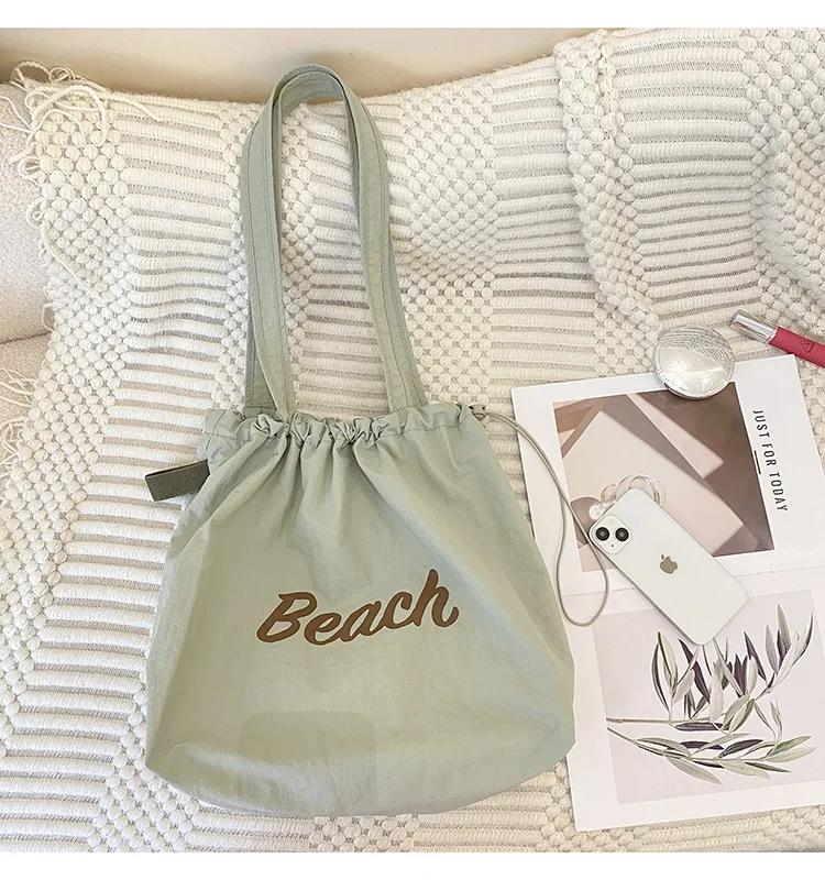 Einfarbige Damen Strand-Schultertasche mit Buchstaben-Design, Damen-Tote aus Canvas, Große Kapazität, Kordelzug, Damen-Einkaufstasche