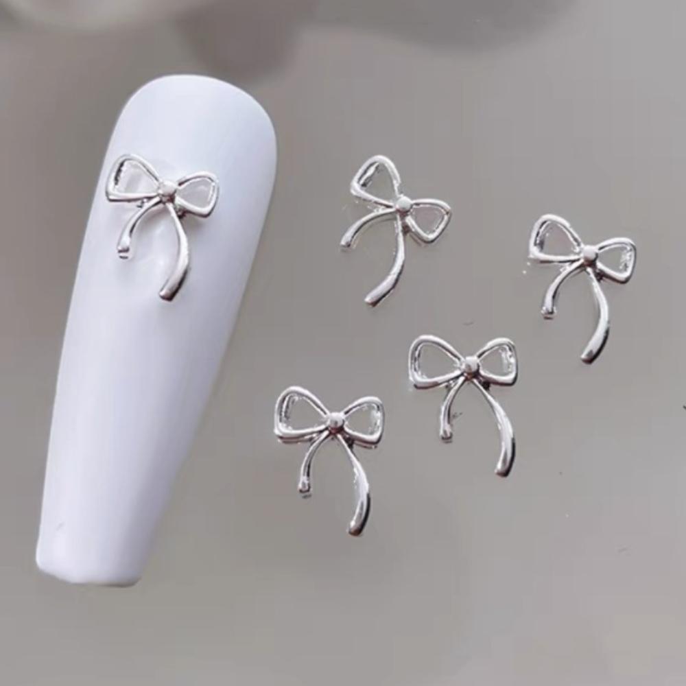 

20pcs/Lot Cute Bowknot Nail Art Charm DIY Manicure Tools for Valentine s Day Christmas Day серебряный