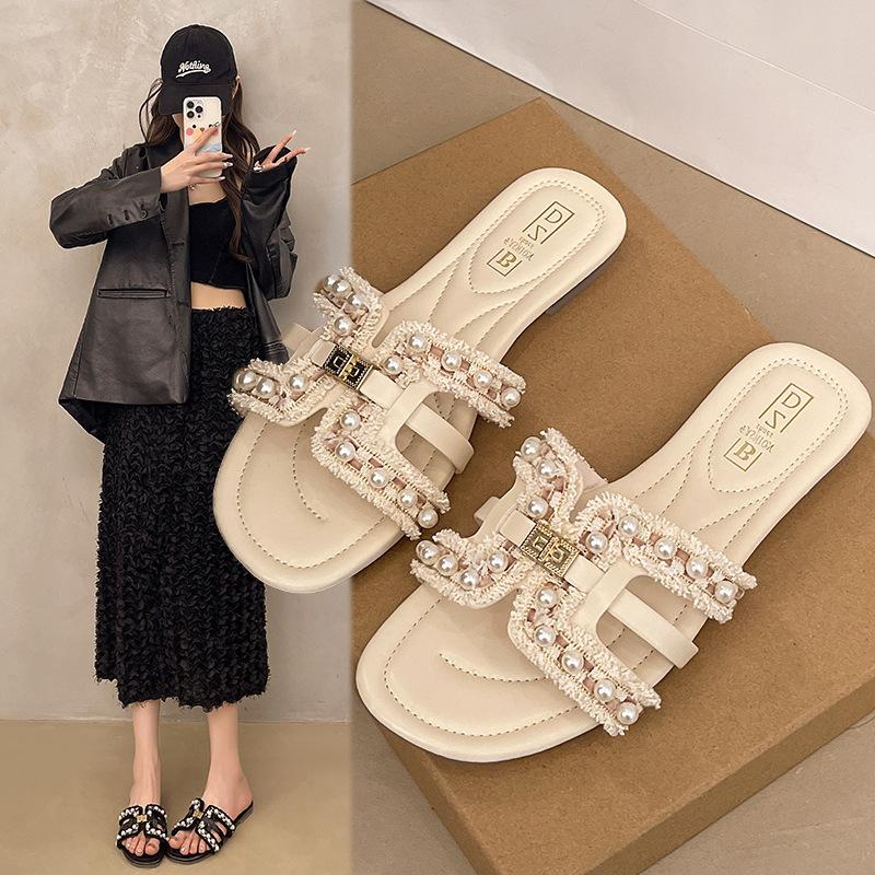 

2025 summer new Xiaoxiangfeng flat-bottomed slippers women wear spring soft-bottomed fairy versatile pearl beach sandals 35 рожевий