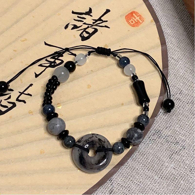 Geflochtenes Perlenarmband im chinesischen Stil: Handgefertigter Unisex-Schmuck im National Tide Design