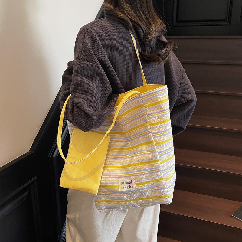 Korean version of casual large-capacity underarm bag women's 2025 new striped canvas bag double-sided back shoulder bucket bag