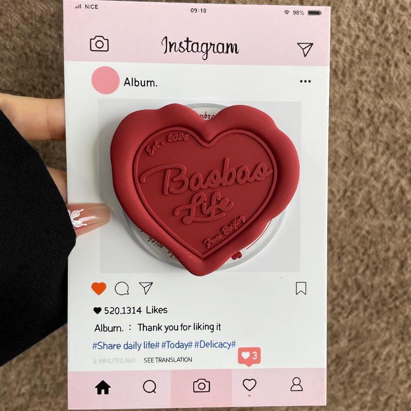MagSafe-Compatible Silicone Heart Stand with Strong Magnetic Hold and Retractable Airbag Design for Desktop Use