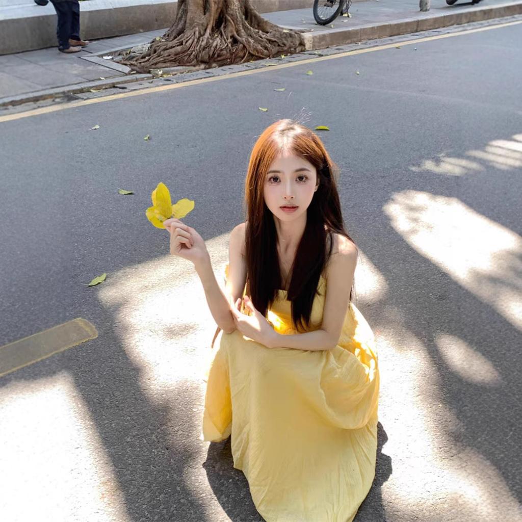 Seaside vacation travel Thailand super beautiful yellow suspender dress women's summer gentle wind waist French long skirt