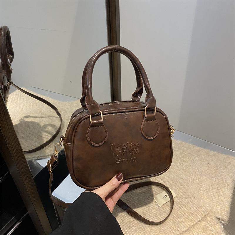 

2025 осень новая однотонная универсальная повседневная женская сумка-тоут высокого класса, с текстурой, персонализированная популярная сумка-мессенджер