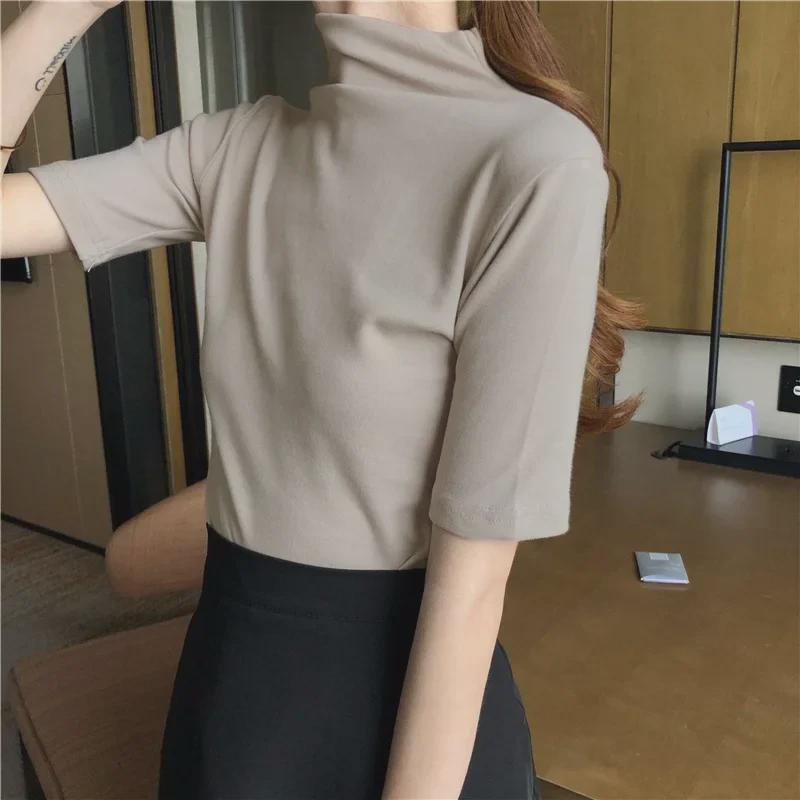 2027 Toma Real: Camiseta de Manga Corta con Cuello Alto Medio Ajustada para Mujer (95 % algodón, 5 % elastano.)