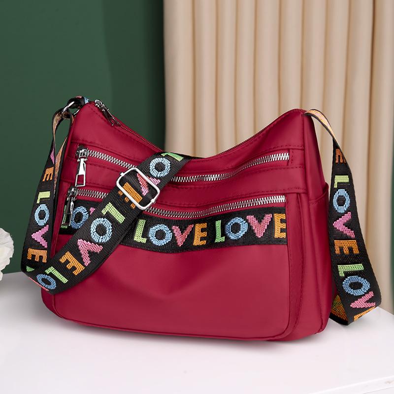 

Cross shoulder bag, single shoulder bag, large capacity multi pocket bag, women s new fashion letter 29x10x20cm червоний