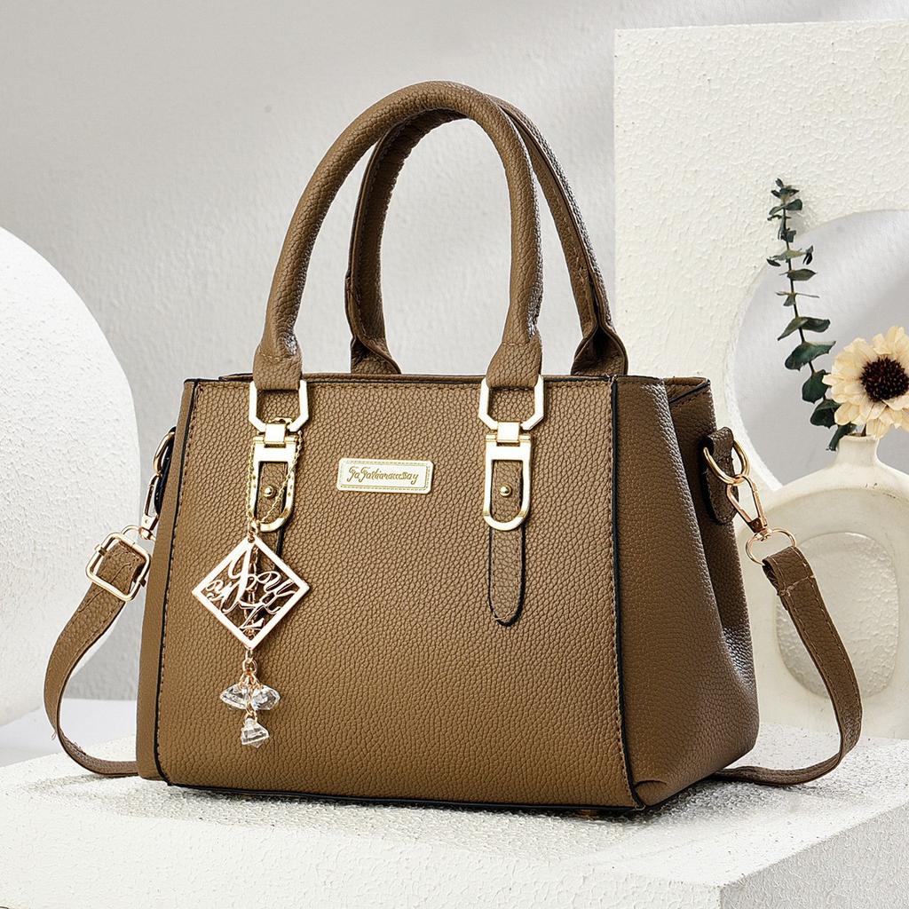 Simple and large-capacity hot-selling handheld women's bags 2026 new fashionable and versatile PU material single shoulder oblique span small