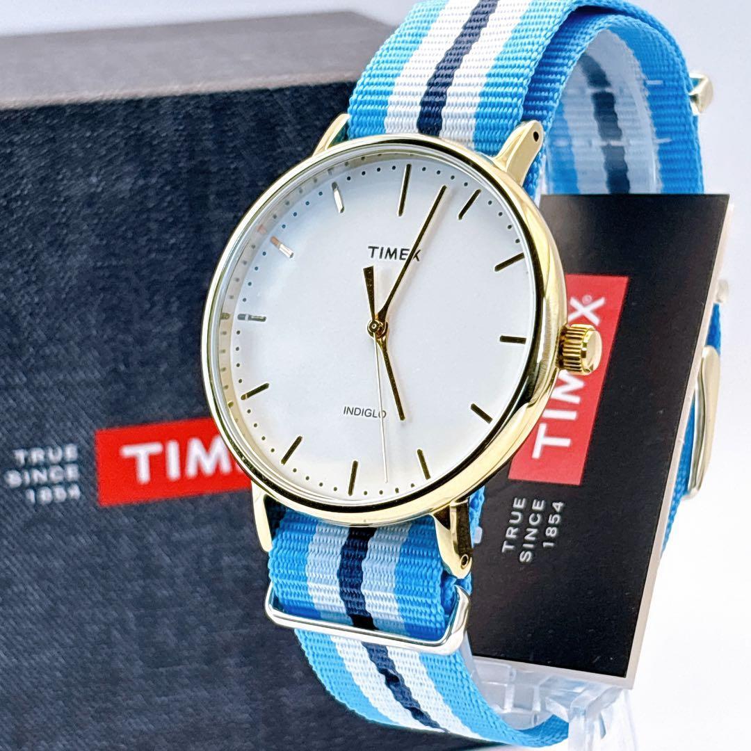 Used New battery, unused TIMEX watch, gold case, box included, light blue