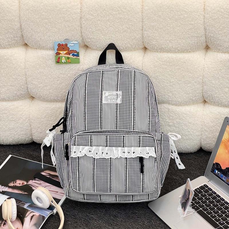 Simple casual striped schoolbag Female junior high school student backpack Large capacity class commuter travel backpack