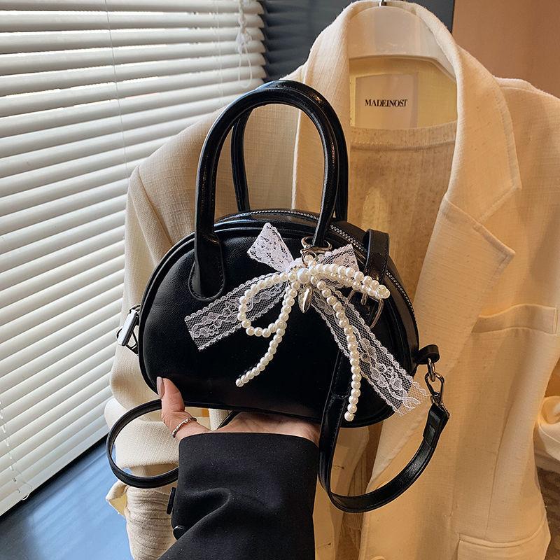 

Корейская портативная сумка для боулинга женская 2025 новый тренд модная сумка-ракушка нишевая универсальная сумка-мессенджер No specification