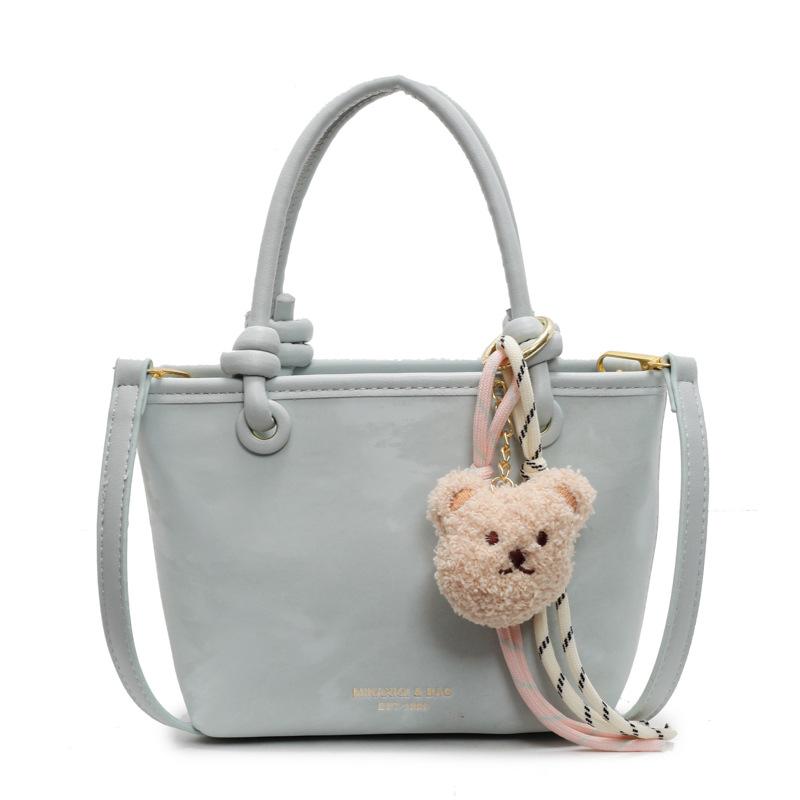 Korean version ins trendy personality contrasting colors casual hand carrying bucket bag fashion high sense versatile temperament messenger bag woman