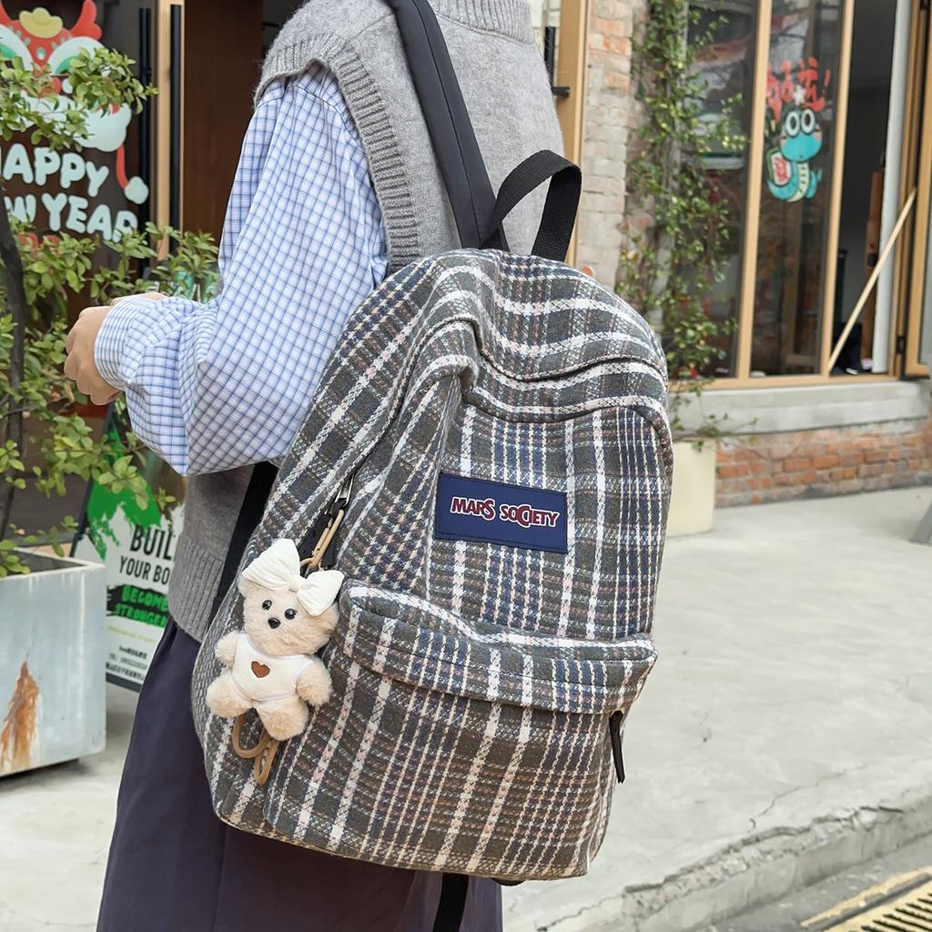 Schultasche Herbst und Winter neuer karierter Rucksack weiblich Koreanischer fauler Stil Pendlerrucksack Grund- und Sekundarschüler Rucksack mit großer Kapazität