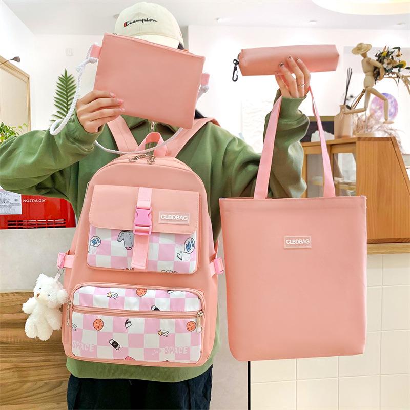 

New schoolbag, primary school student burden reduction backpack, light plaid four-piece student backpack рожевий